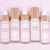 wander beauty 5 light pink bottles with golden lids