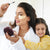 mother and daughter, with mom applying wander beauty mascara and under eye patches